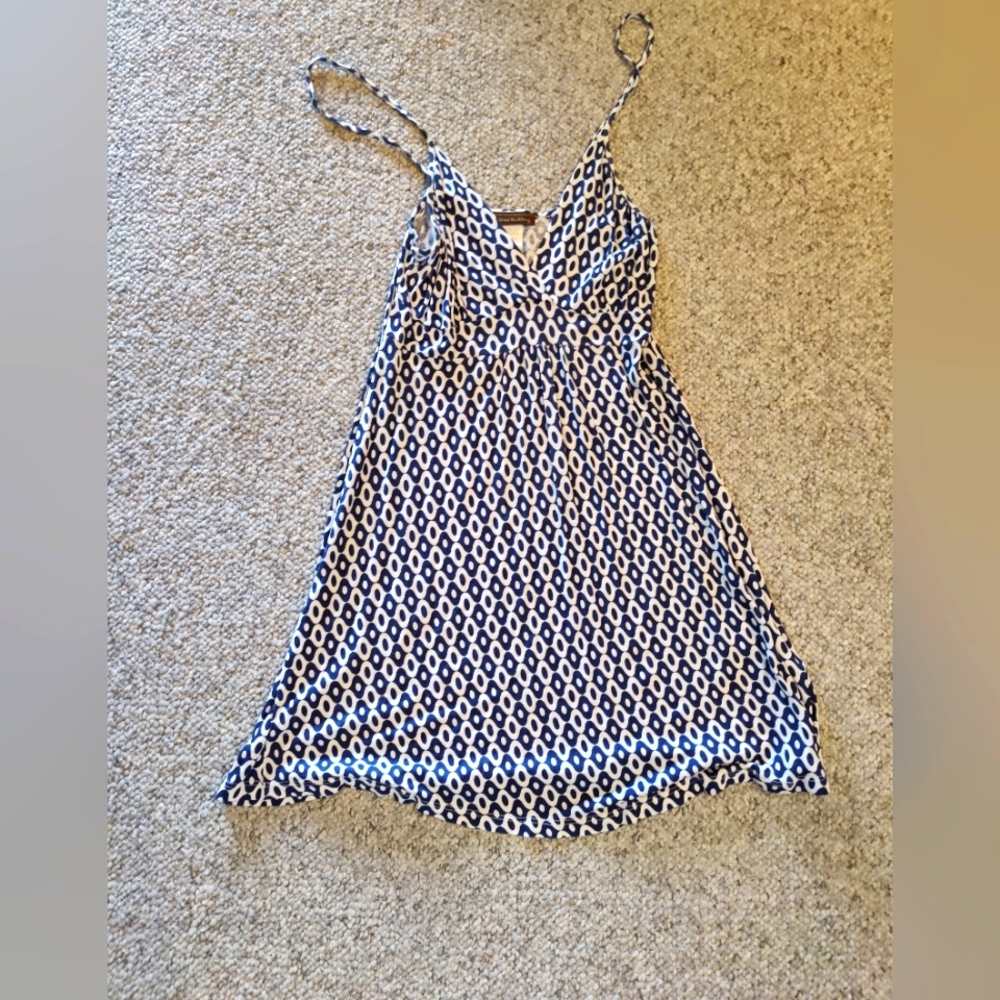 Adorable sundress or bathing suit cover up.
